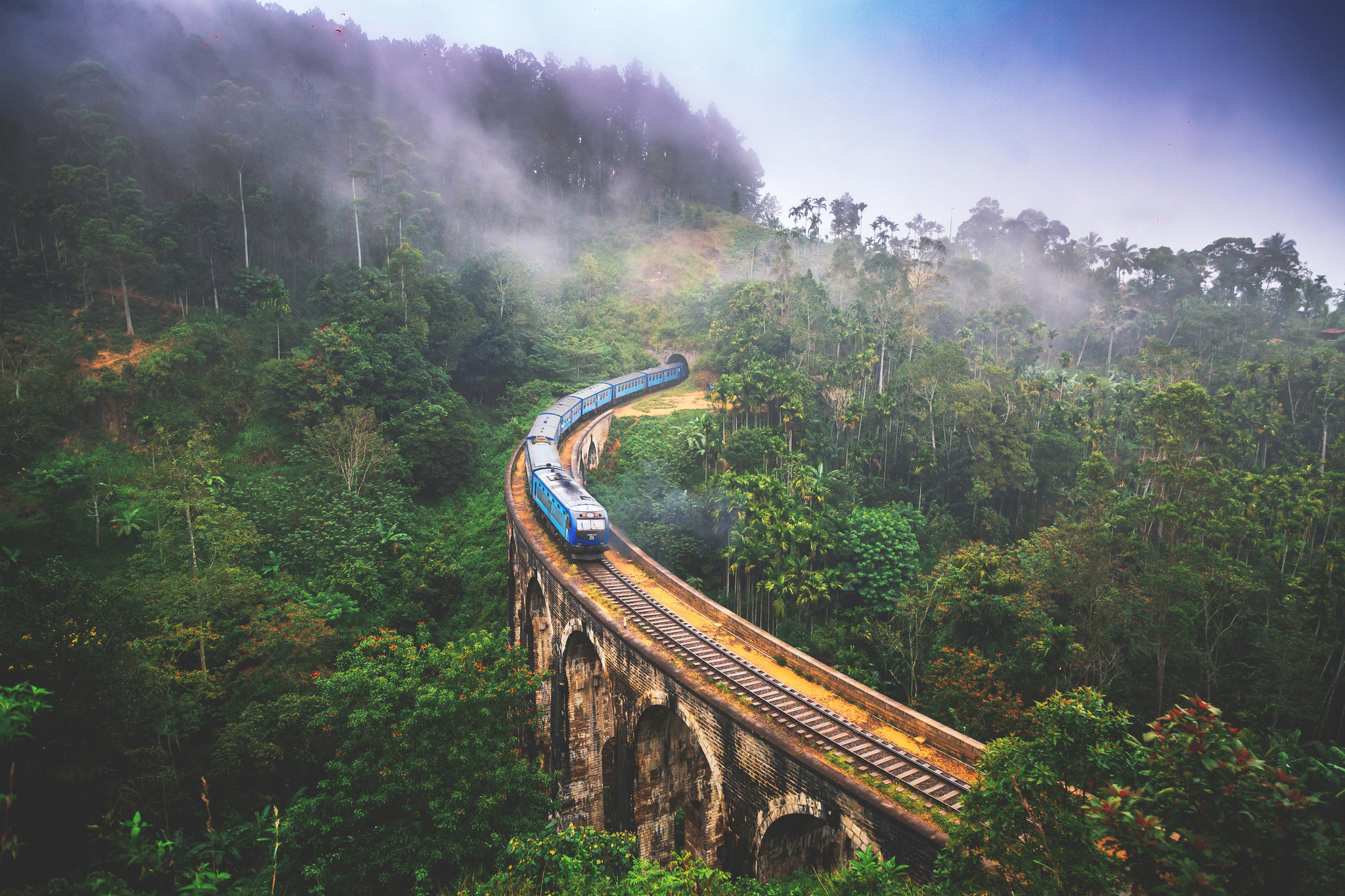 A misty train journey across Nine Arches Bridge
